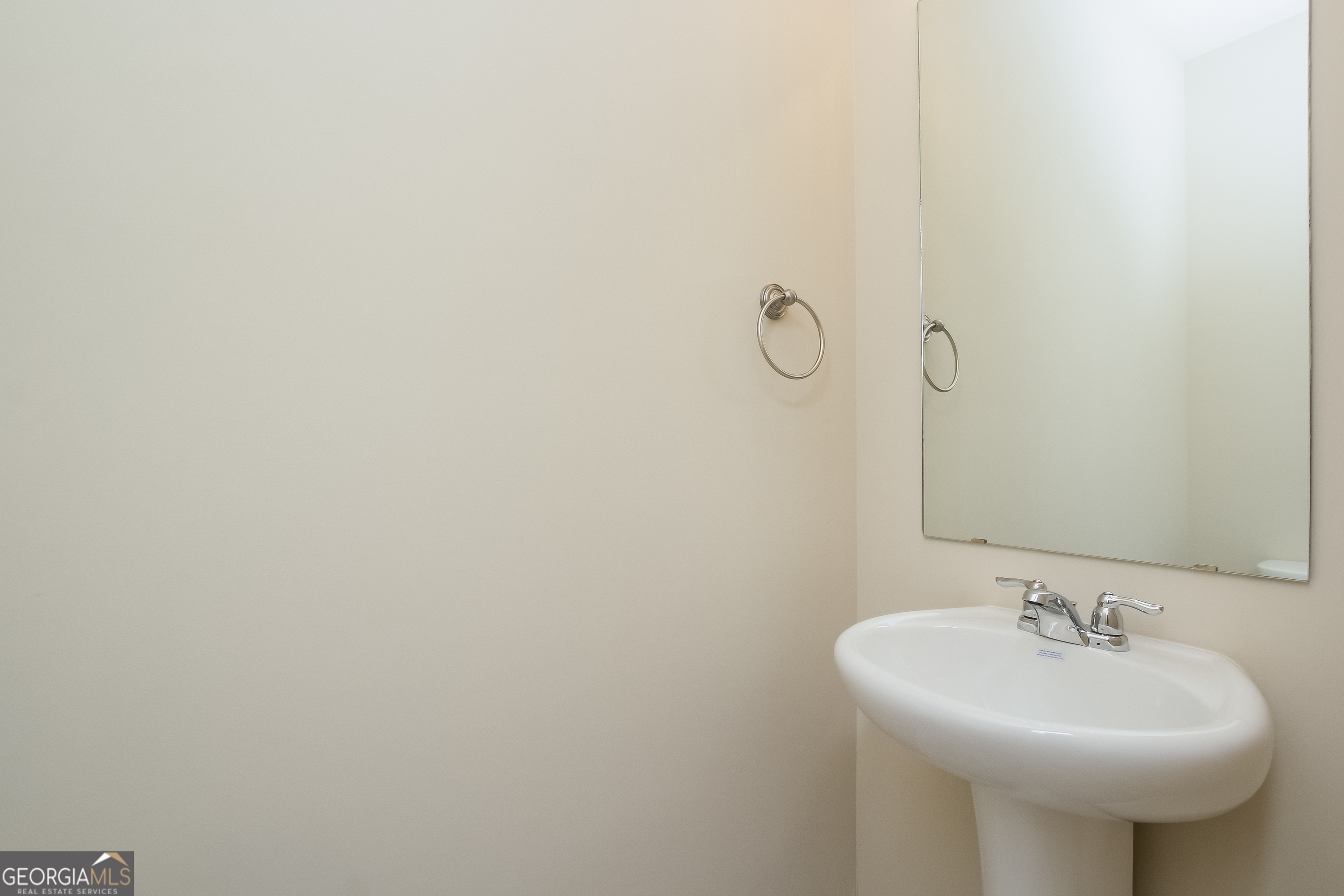 635 Independence Avenue Pendergrass, GA 30567 - Photo 13 of 15 a bathroom with a sink and mirror