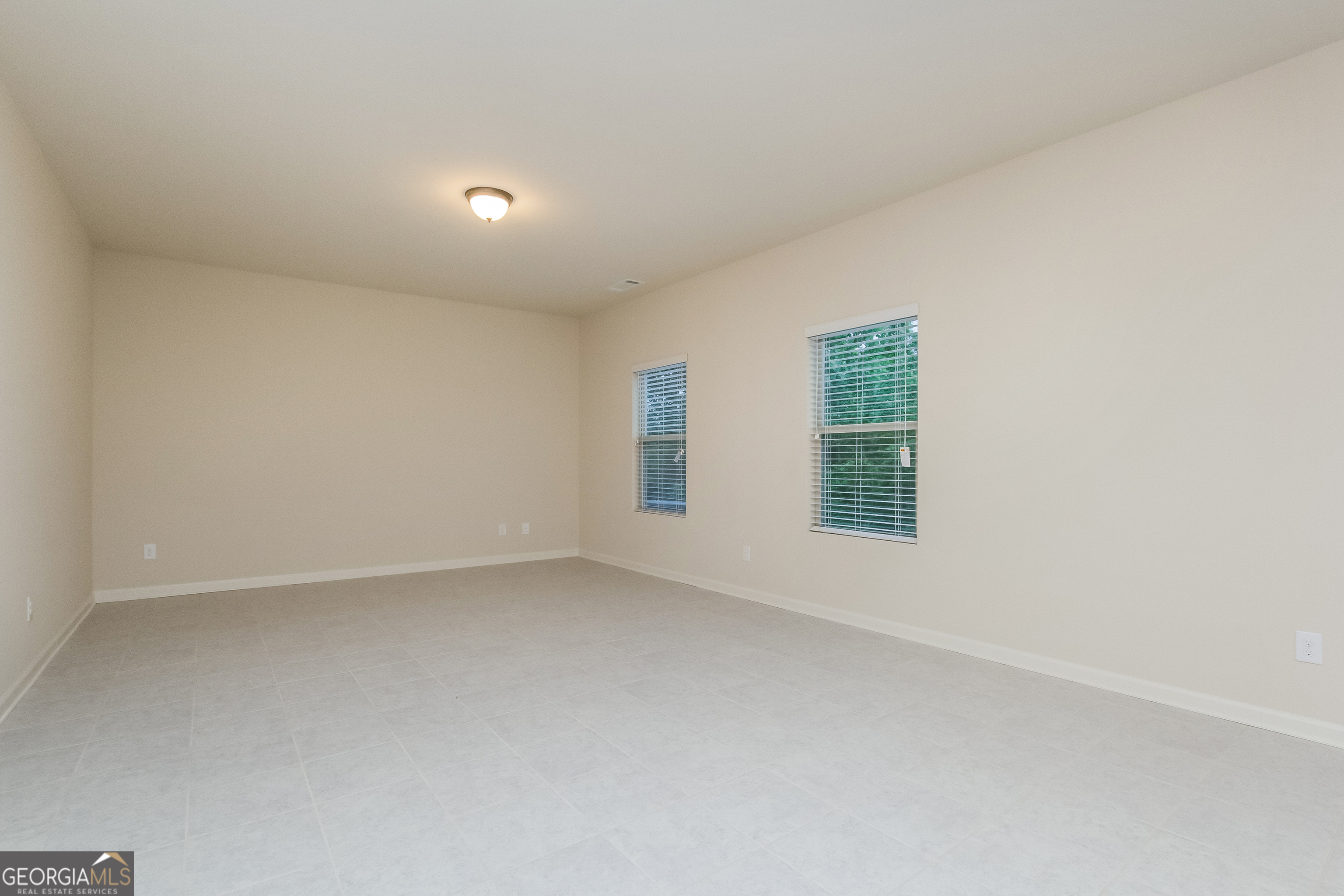 635 Independence Avenue Pendergrass, GA 30567 - Photo 2 of 15 an empty room with windows