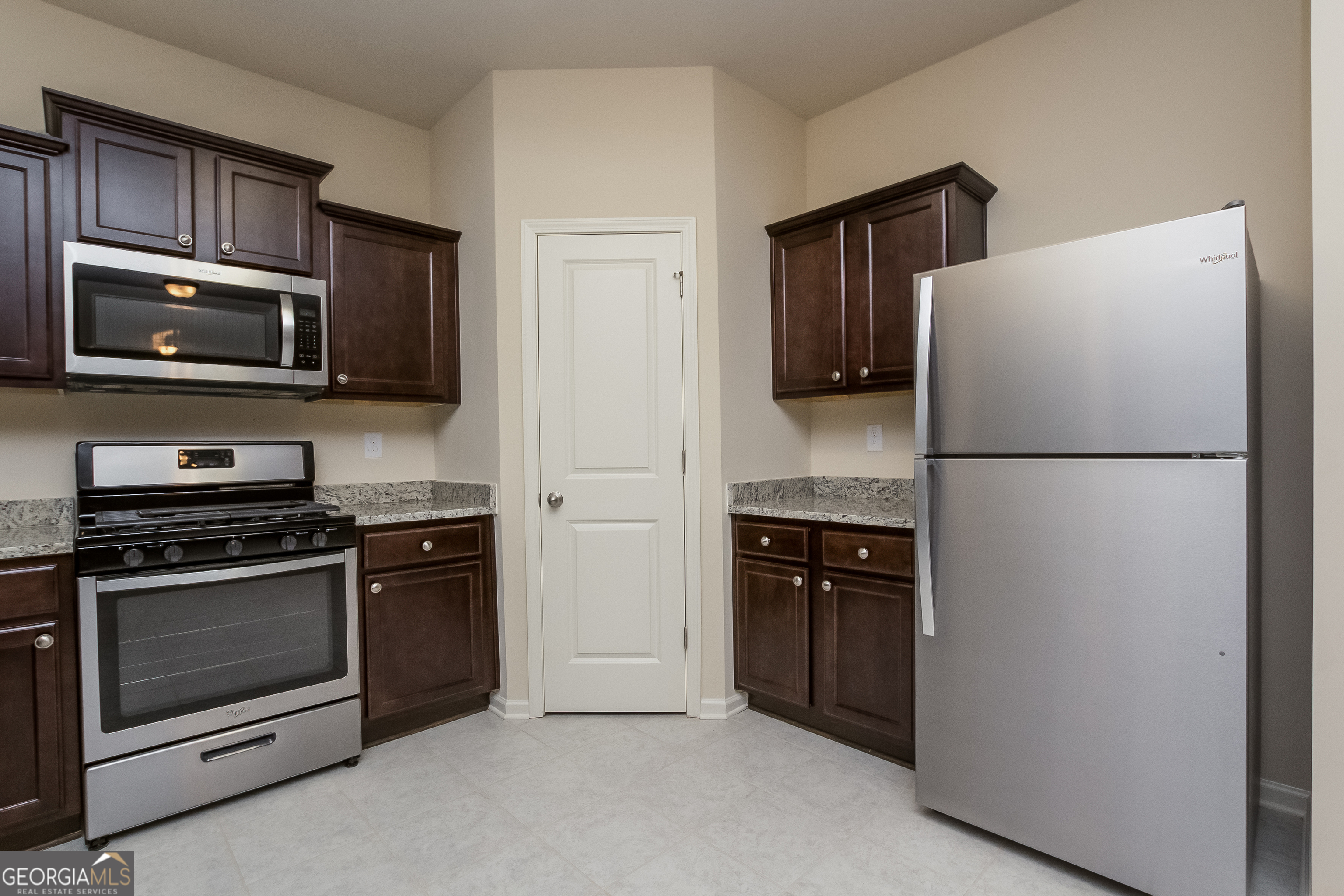 635 Independence Avenue Pendergrass, GA 30567 - Photo 5 of 15 a kitchen with a refrigerator stove and microwave