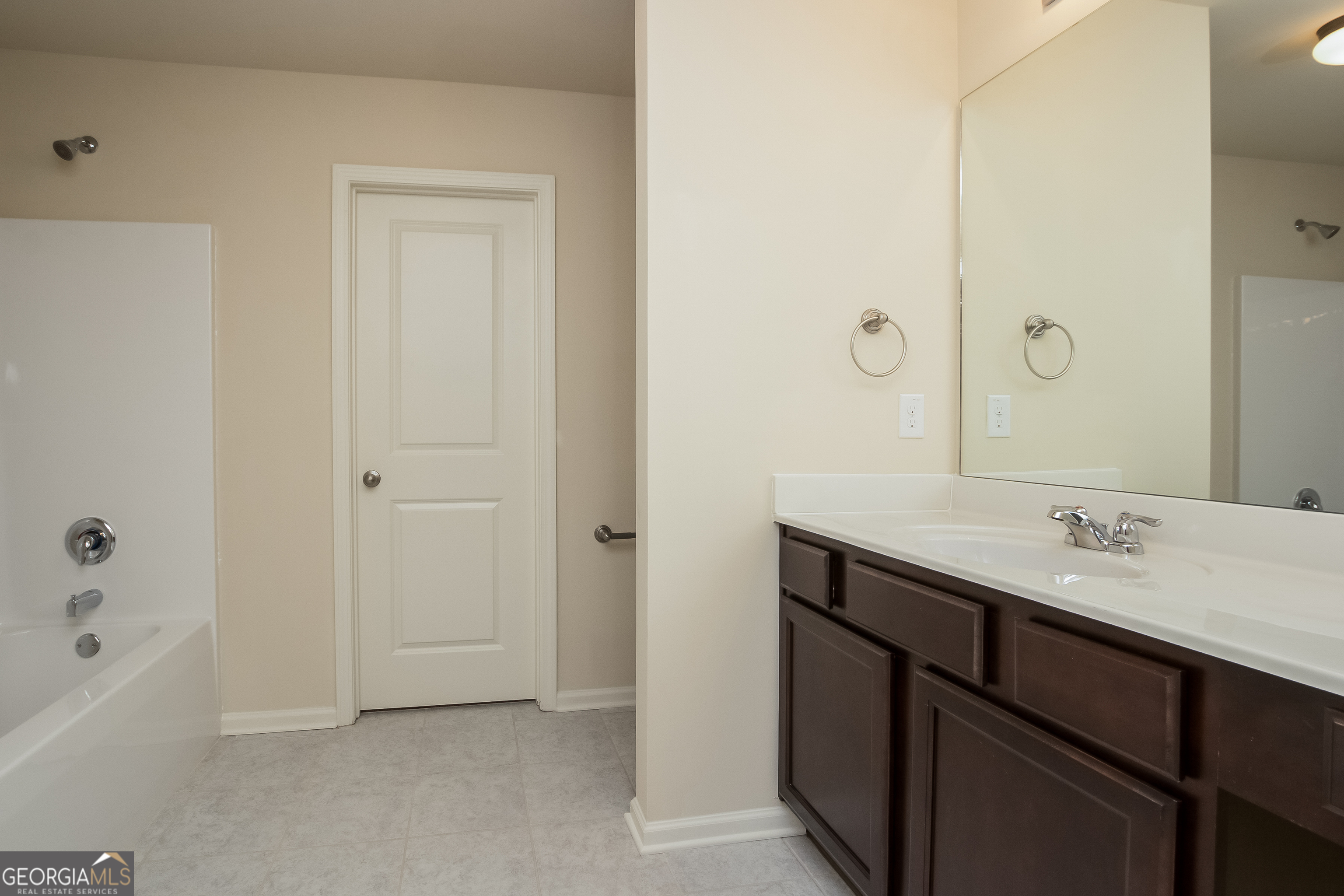 635 Independence Avenue Pendergrass, GA 30567 - Photo 6 of 15 a view of bathroom with a sink mirror and shower