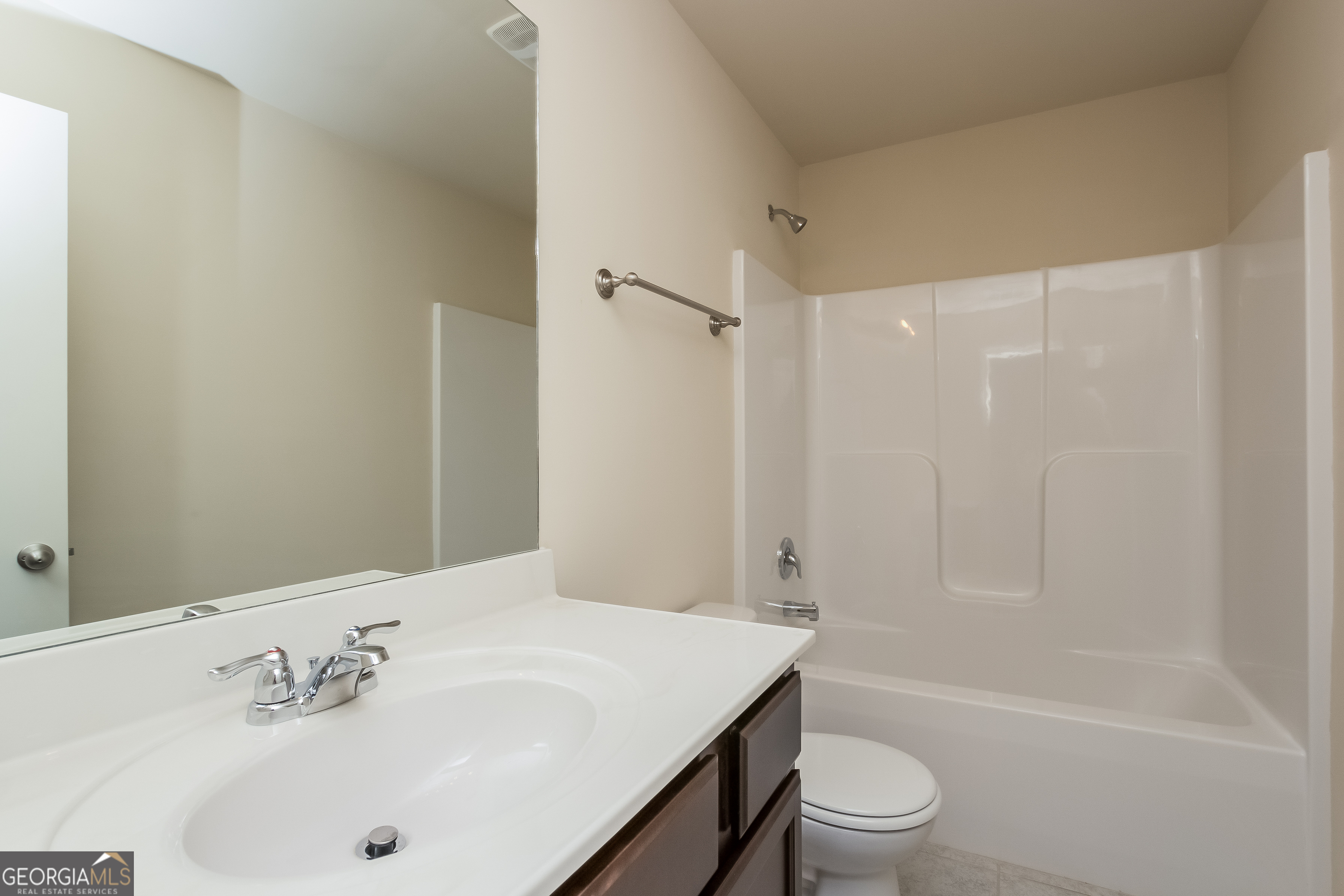 635 Independence Avenue Pendergrass, GA 30567 - Photo 7 of 15 a bathroom with a sink a toilet and shower