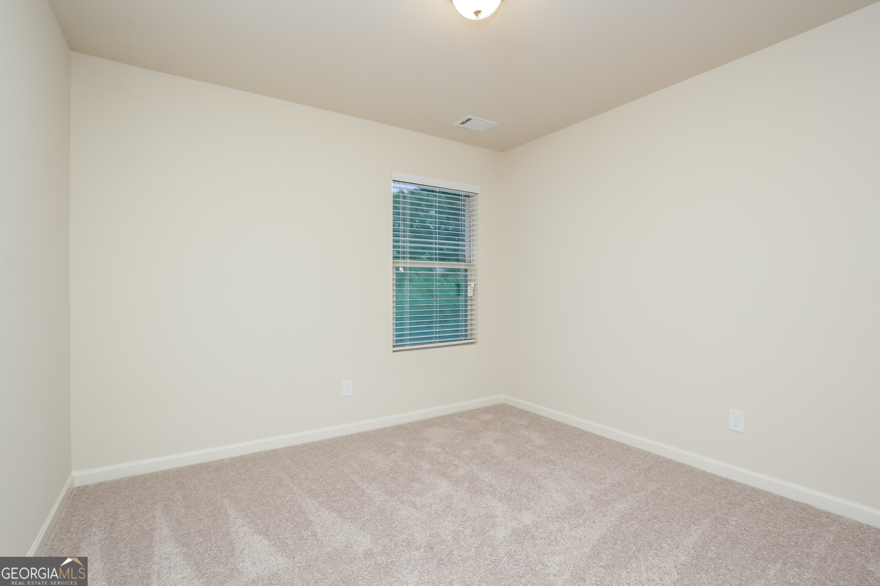 635 Independence Avenue Pendergrass, GA 30567 - Photo 9 of 15 an empty room with a window