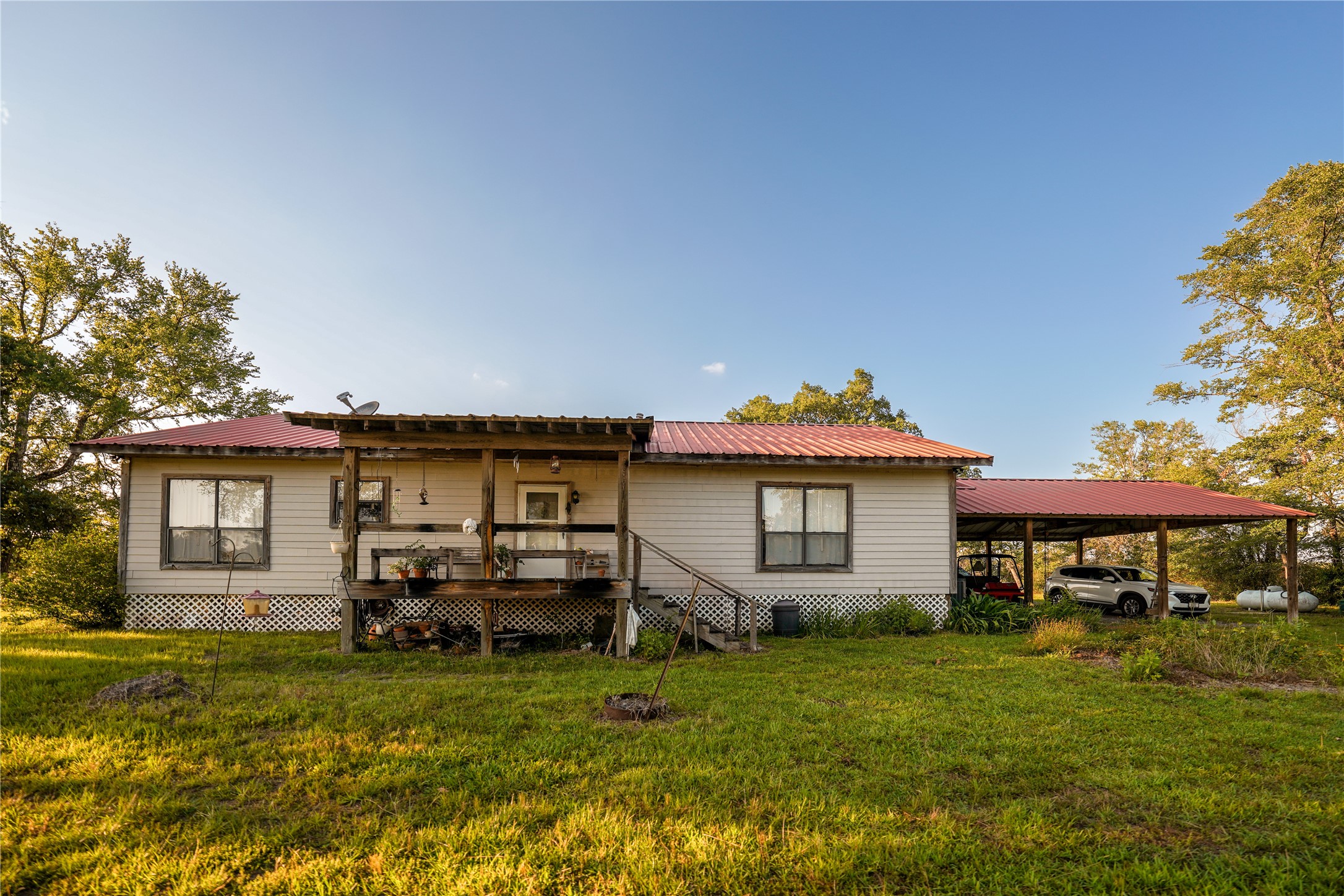 148 Lake Falls Road Huntsville, TX 77320 - Photo 4 of 14 Back of House and Carport