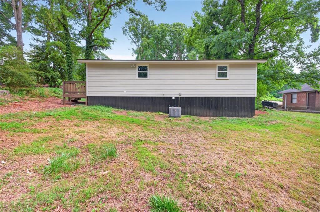 136 Nowell Street Monroe, GA 30655 - Photo 6 of 25 a front view of a house with garden