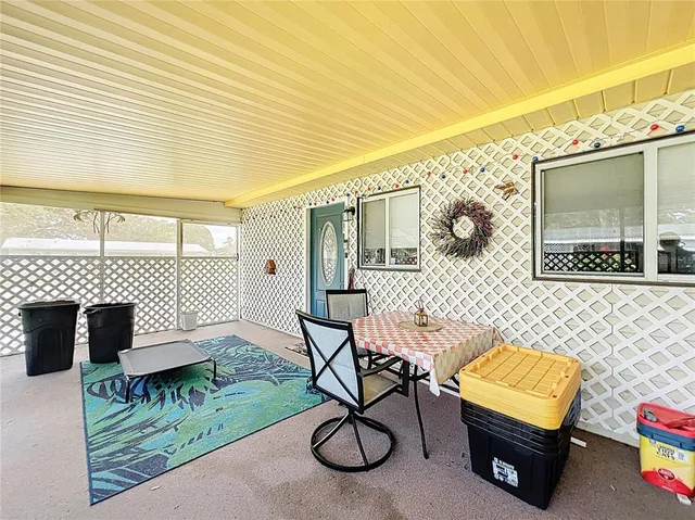 a view of a chairs and table in the patio