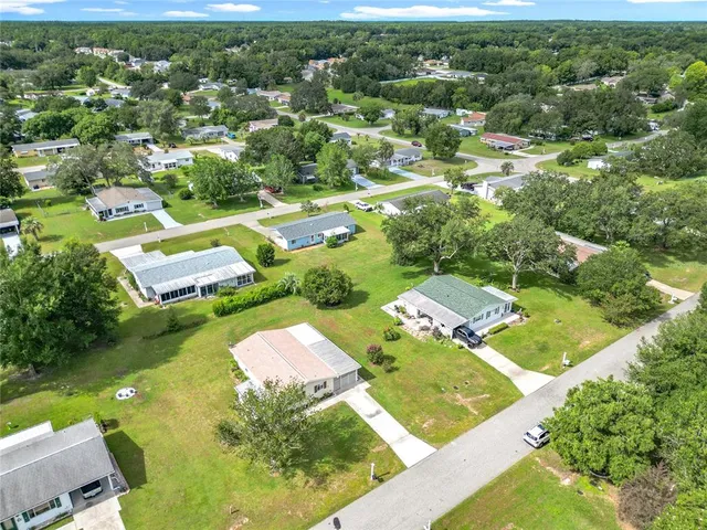 an aerial view of a house with a garden