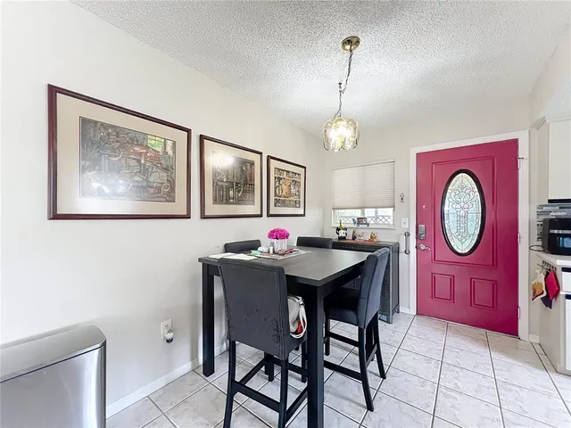 a kitchen with stainless steel appliances granite countertop a sink dishwasher stove and refrigerator