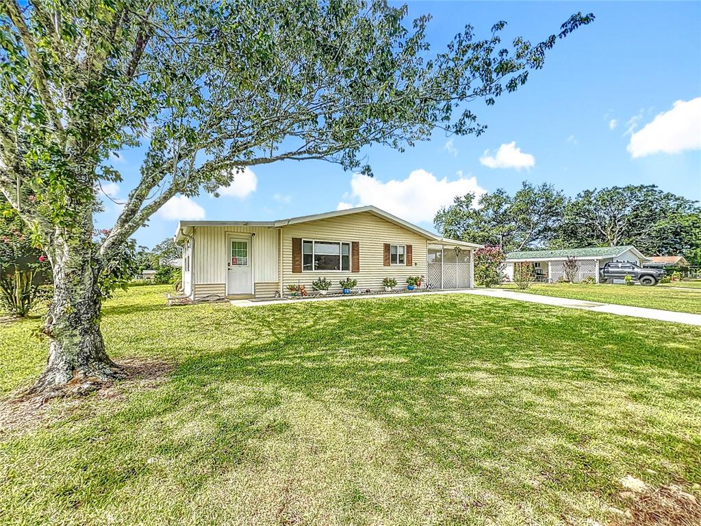 6468 Southwest 107th Place Ocala, FL 34476 - Photo 24 of 53 a front view of house with yard and green space