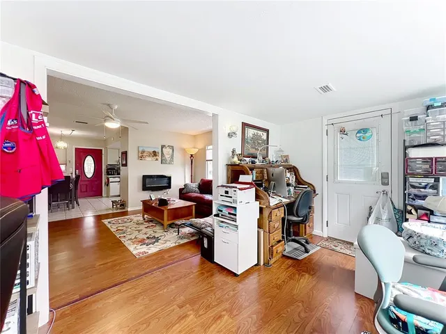 a bedroom with bed and a chandelier