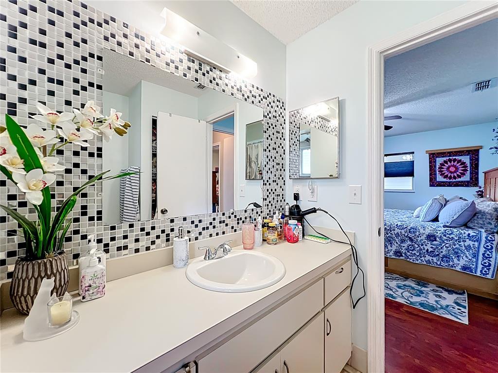 6468 Southwest 107th Place Ocala, FL 34476 - Photo 32 of 53 a bathroom with a sink and a mirror