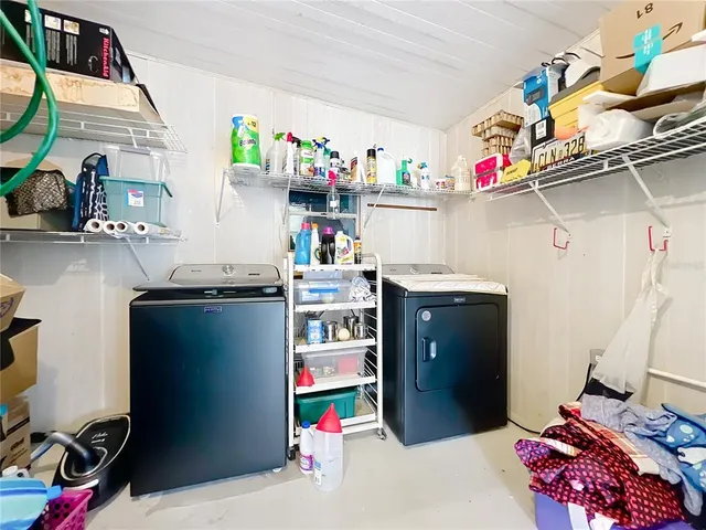 a bedroom with a bed and a table