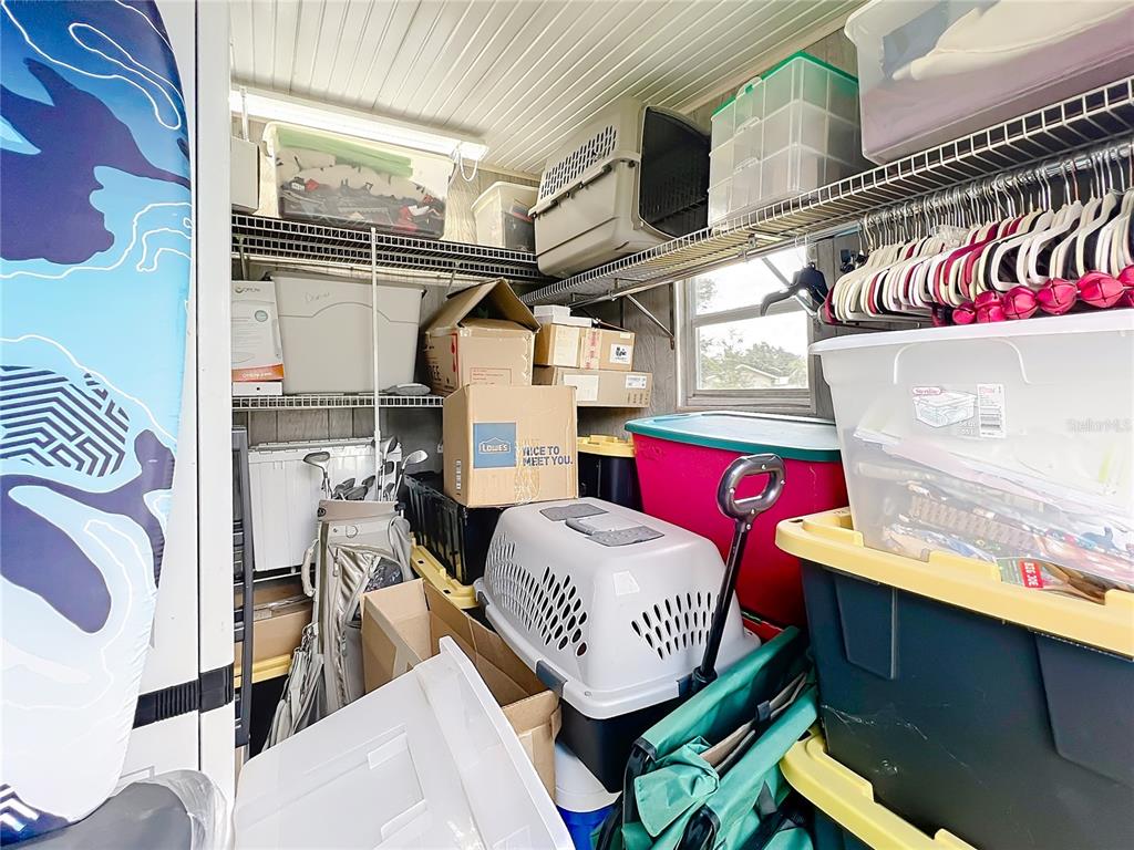 6468 Southwest 107th Place Ocala, FL 34476 - Photo 37 of 53 a bedroom with a bed and a table