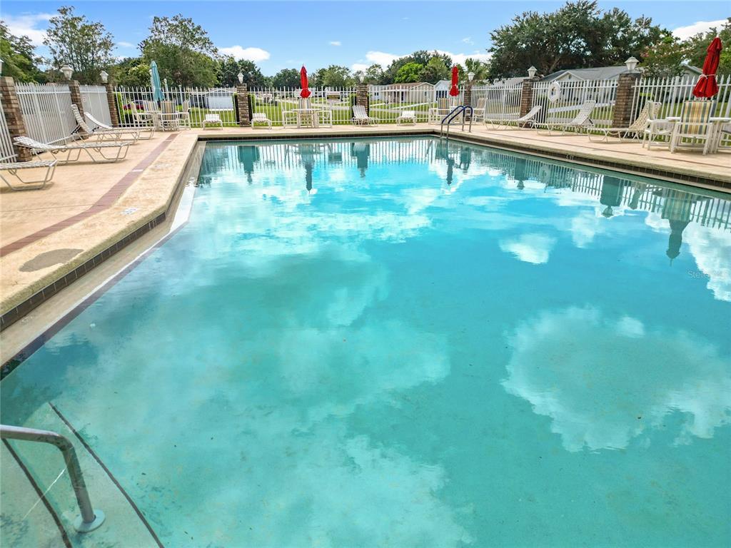 6468 Southwest 107th Place Ocala, FL 34476 - Photo 47 of 53 a view of a swimming pool with a lake view