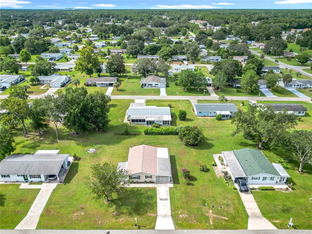 6468 Southwest 107th Place Ocala, FL 34476 - Photo 51 of 53 an aerial view of a house with a garden