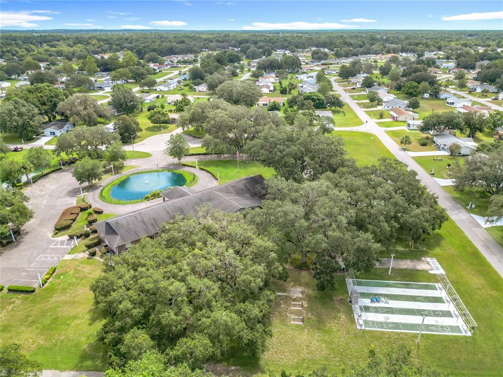 6468 Southwest 107th Place Ocala, FL 34476 - Photo 53 of 53 an aerial view of residential houses with outdoor space and swimming pool