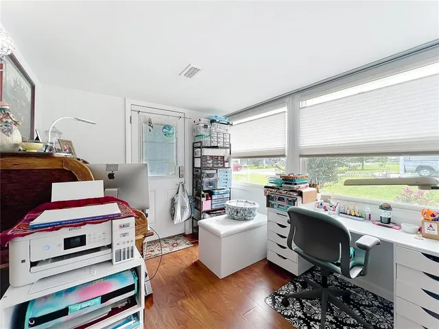 a room with furniture and a wooden floor