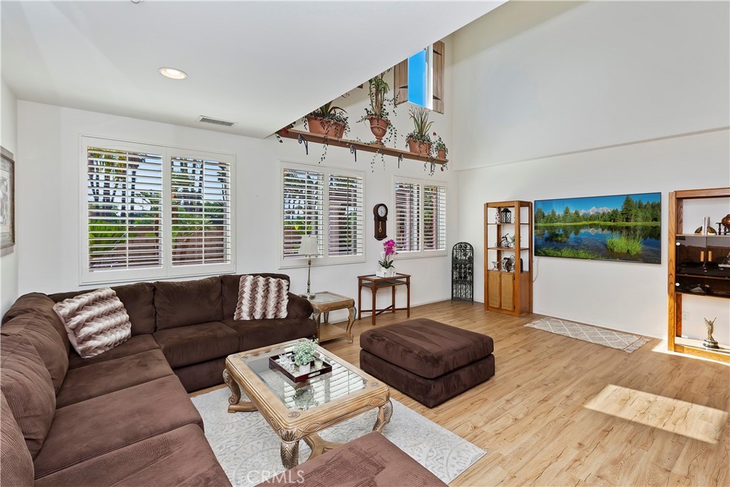 11416 Bridgeway Drive Riverside, CA 92505 - Photo 12 of 54 a living room with furniture and a large window
