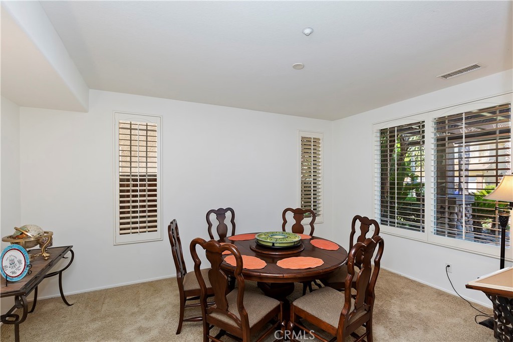 11416 Bridgeway Drive Riverside, CA 92505 - Photo 13 of 54 a view of a dining room with furniture and windows