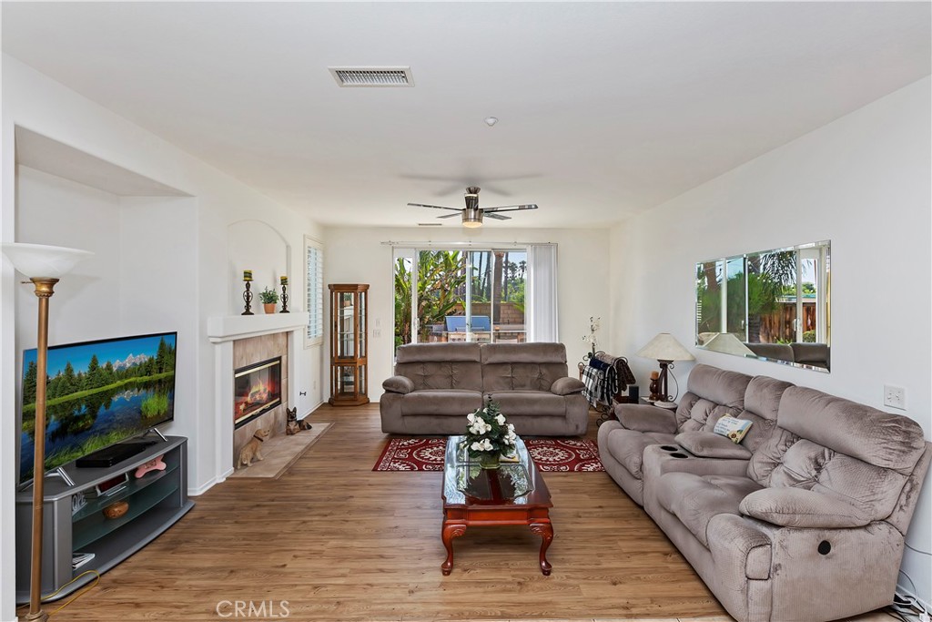 11416 Bridgeway Drive Riverside, CA 92505 - Photo 20 of 54 a living room with furniture and a flat screen tv