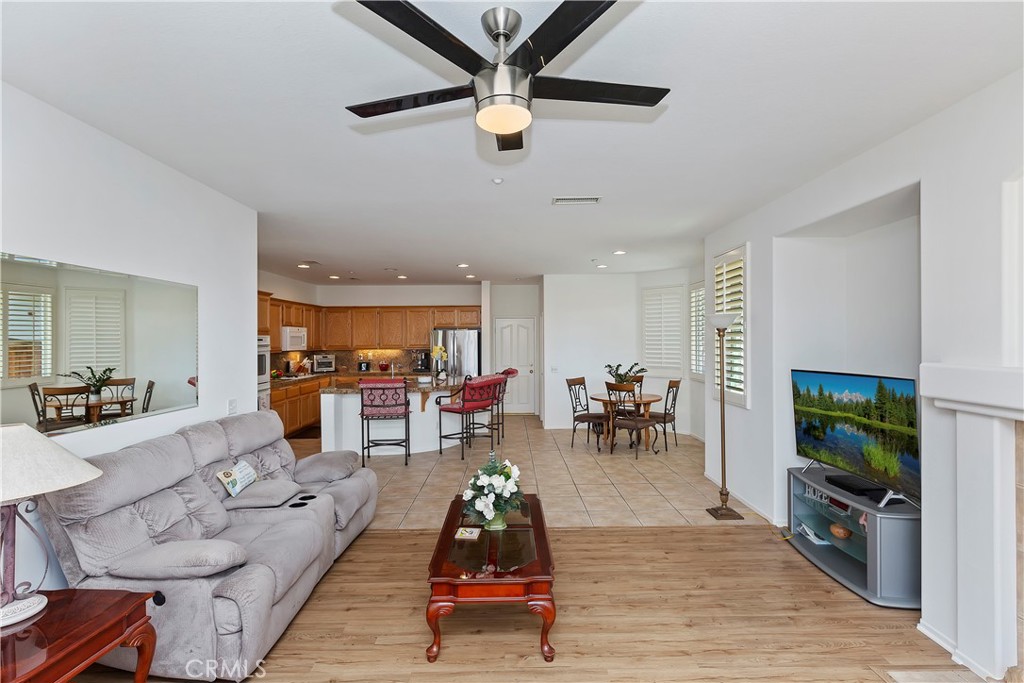 11416 Bridgeway Drive Riverside, CA 92505 - Photo 21 of 54 a living room with furniture and a flat screen tv