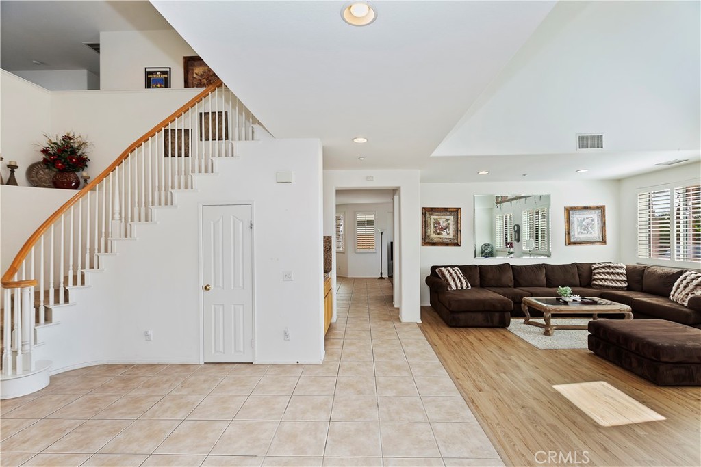 11416 Bridgeway Drive Riverside, CA 92505 - Photo 22 of 54 a living room with furniture and wooden floor