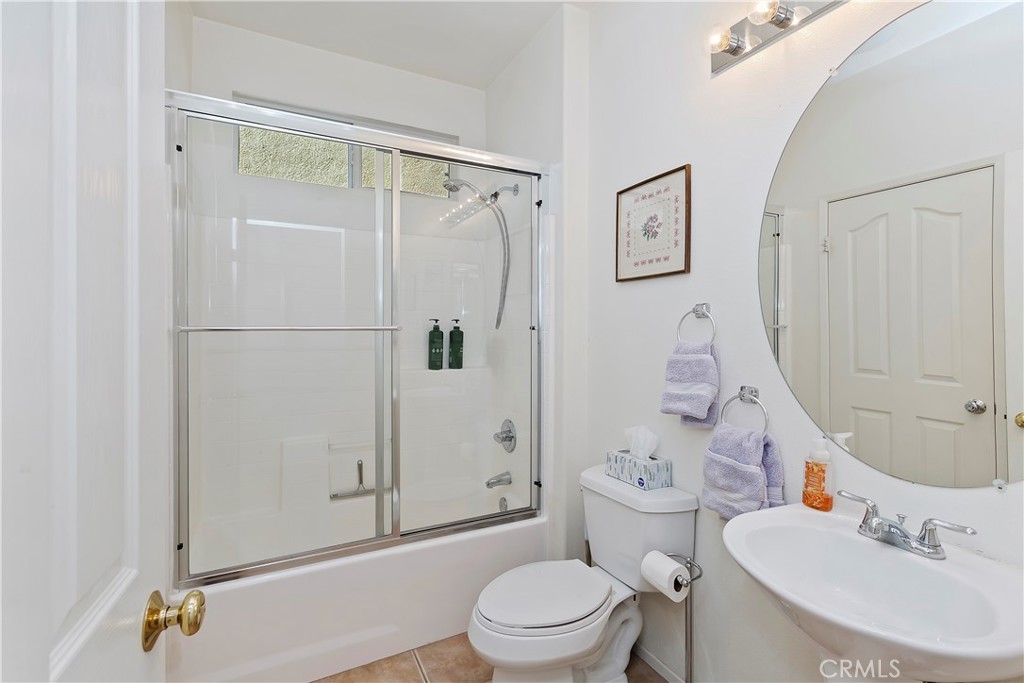 11416 Bridgeway Drive Riverside, CA 92505 - Photo 25 of 54 a bathroom with a sink toilet and shower