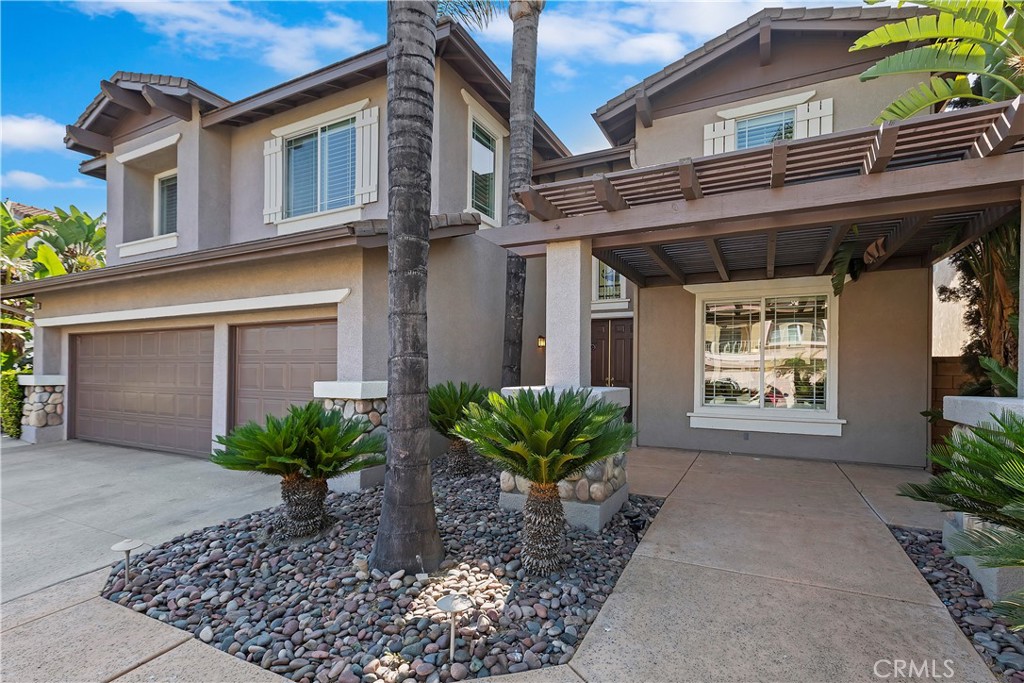 11416 Bridgeway Drive Riverside, CA 92505 - Photo 3 of 54 a front view of a house with garden