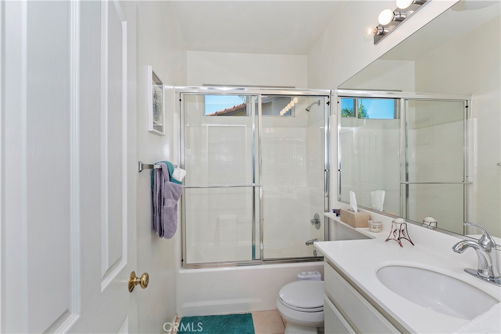 11416 Bridgeway Drive Riverside, CA 92505 - Photo 32 of 54 a bathroom with a sink toilet and shower