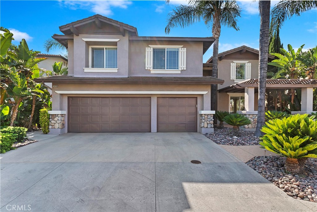 11416 Bridgeway Drive Riverside, CA 92505 - Photo 4 of 54 a front view of a house with a garden