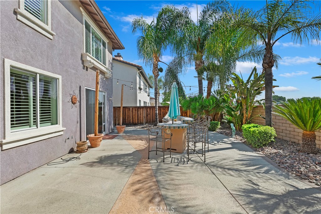 11416 Bridgeway Drive Riverside, CA 92505 - Photo 48 of 54 a view of a patio with a table and chairs and potted plants