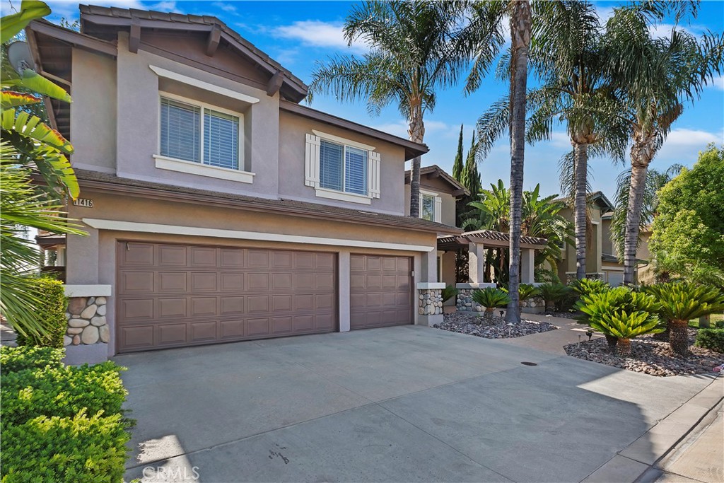 11416 Bridgeway Drive Riverside, CA 92505 - Photo 5 of 54 a view of a house with a yard and potted plants