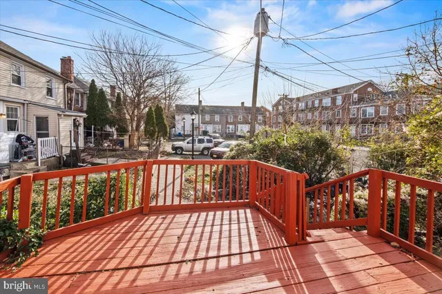 a view of a wooden deck with city view