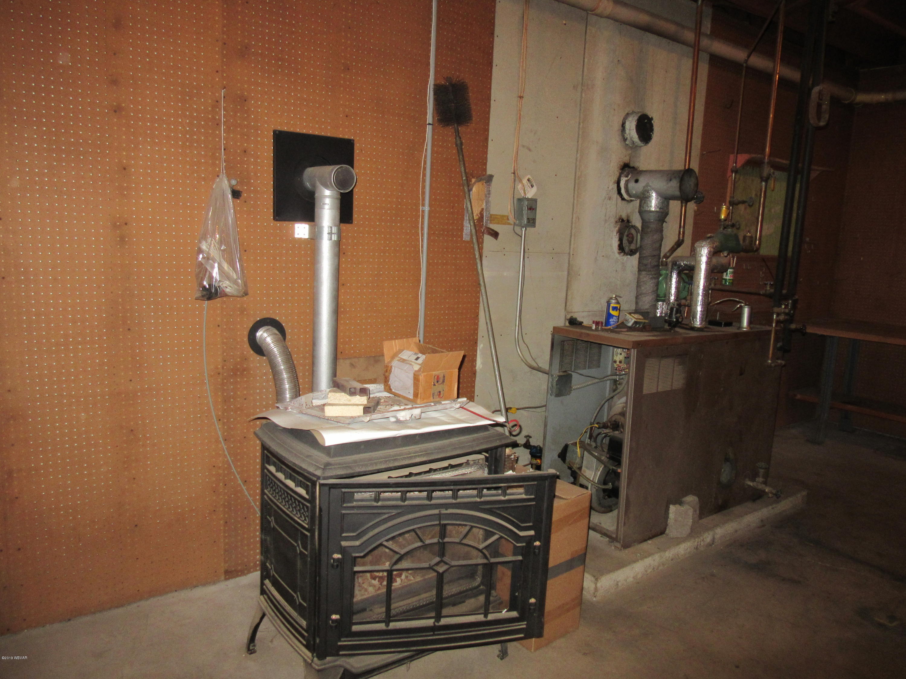 1457 Rockey Road Loganton, PA 17747 - Photo 18 of 22 Wood pellet stove and oil burner