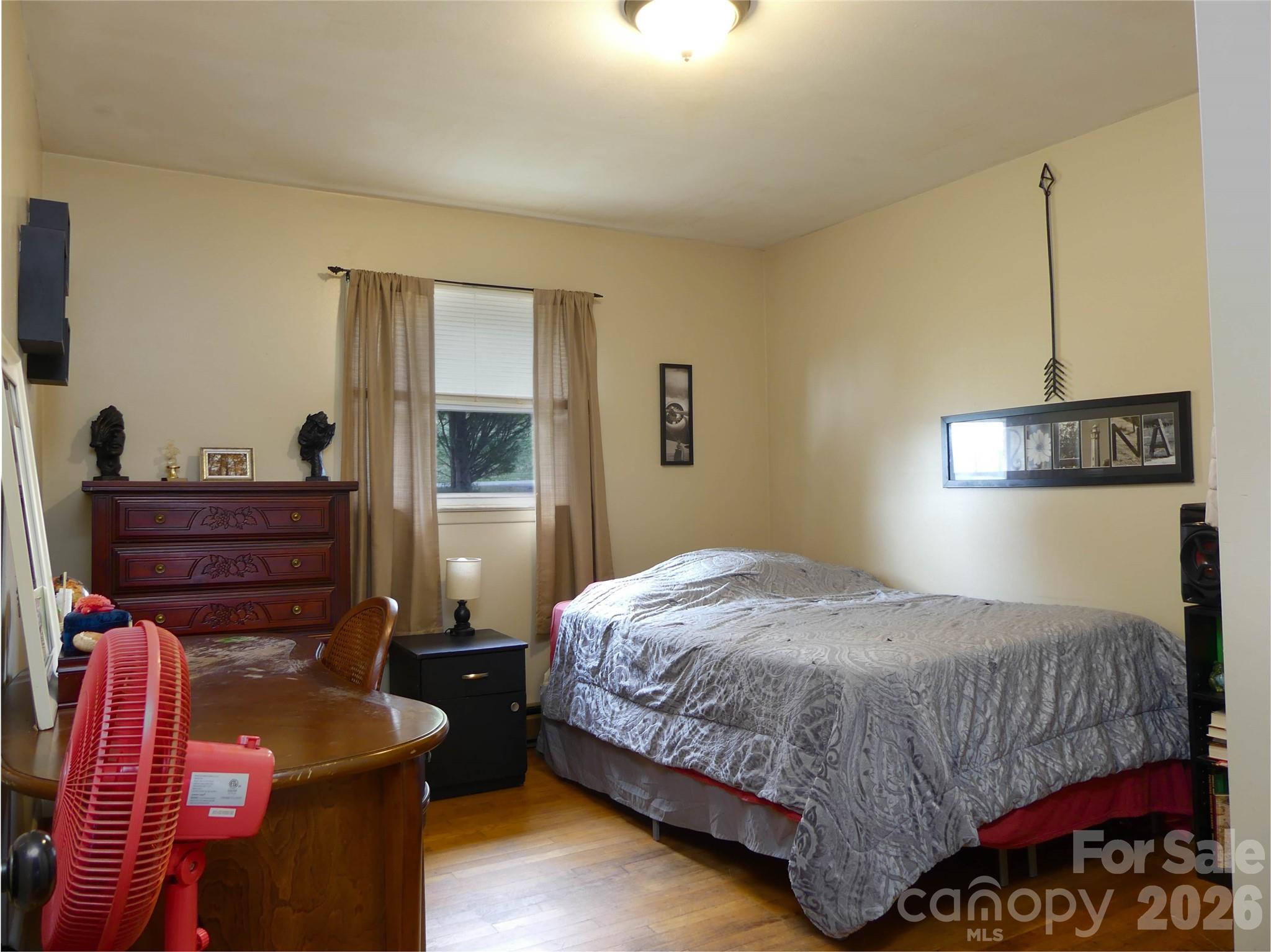 4636 Oak Hill School Road Lenoir, NC 28645 - Photo 15 of 23 a bedroom with a bed and a dresser
