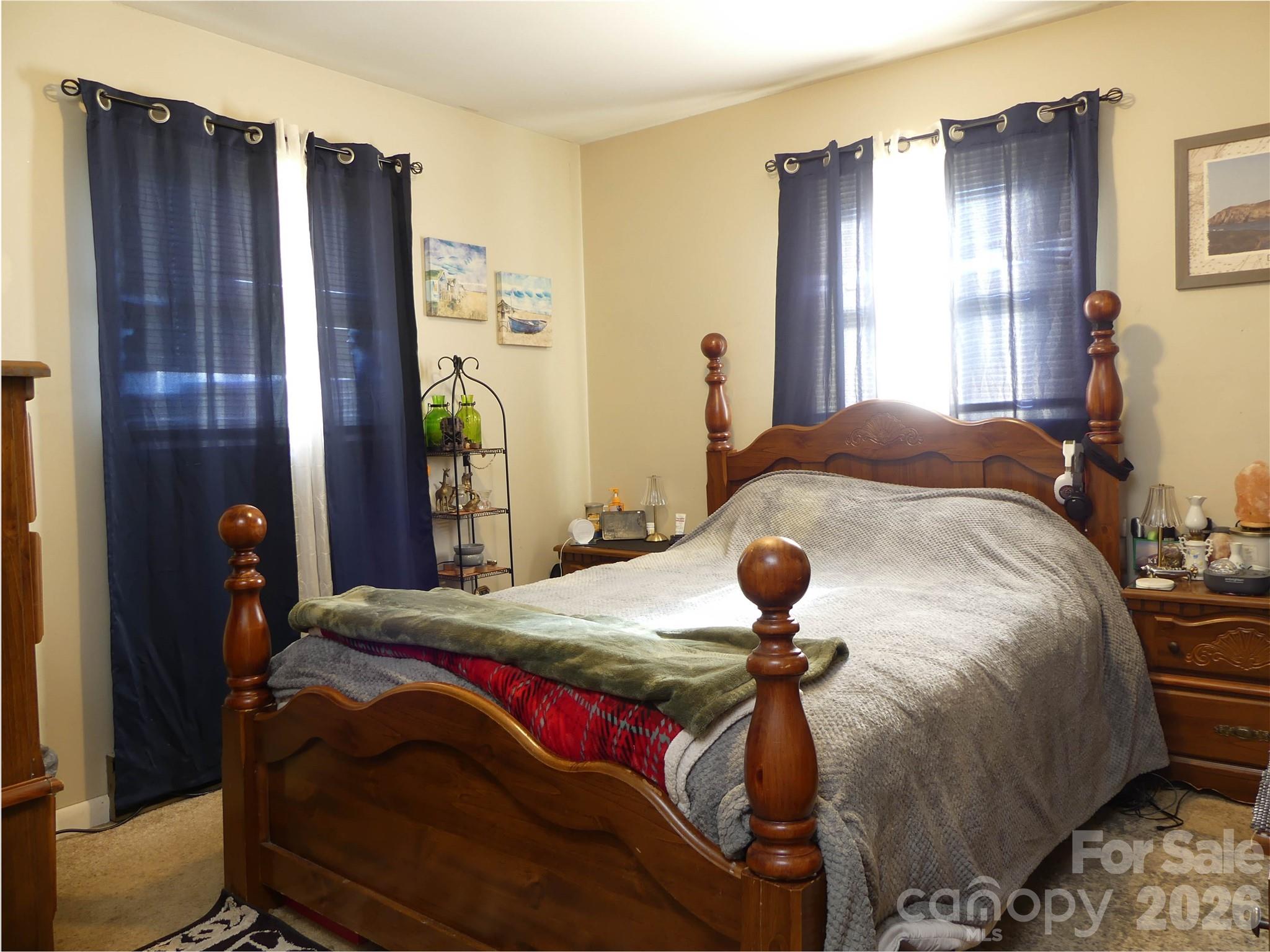 4636 Oak Hill School Road Lenoir, NC 28645 - Photo 17 of 23 a bedroom with a bed and a window