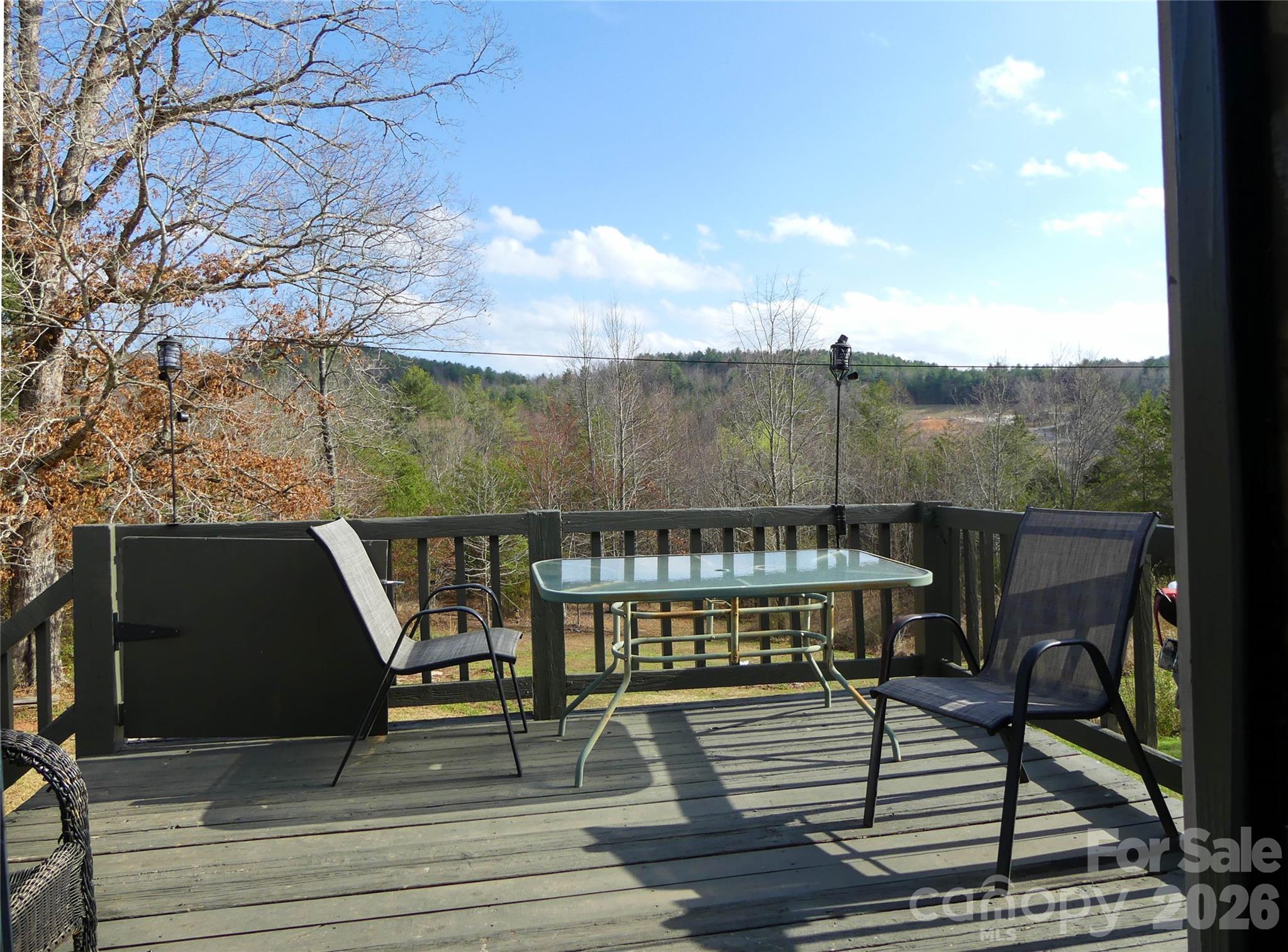 4636 Oak Hill School Road Lenoir, NC 28645 - Photo 18 of 23 a view of balcony with wooden floor and outdoor seating