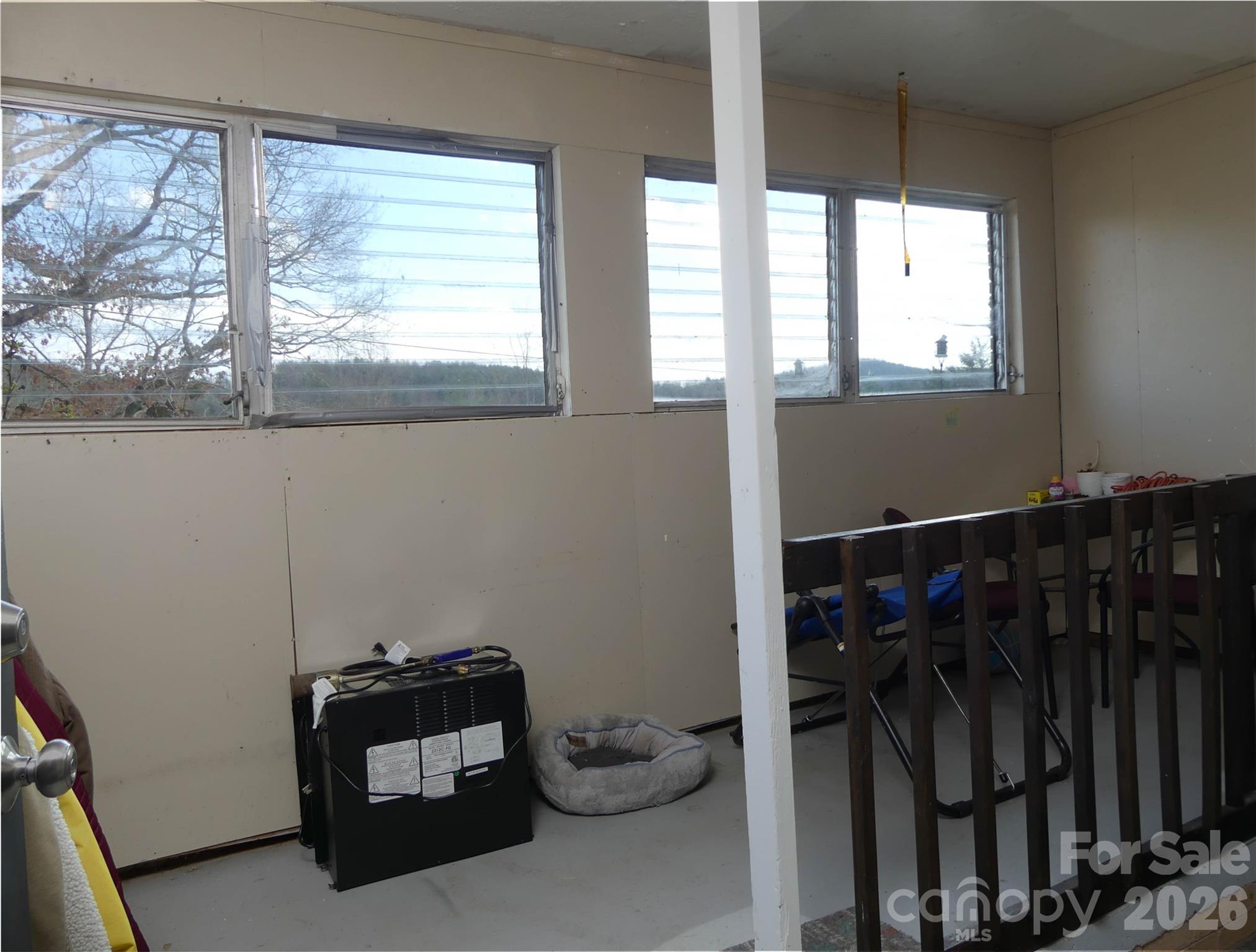 4636 Oak Hill School Road Lenoir, NC 28645 - Photo 19 of 23 a room with gym equipment and a window