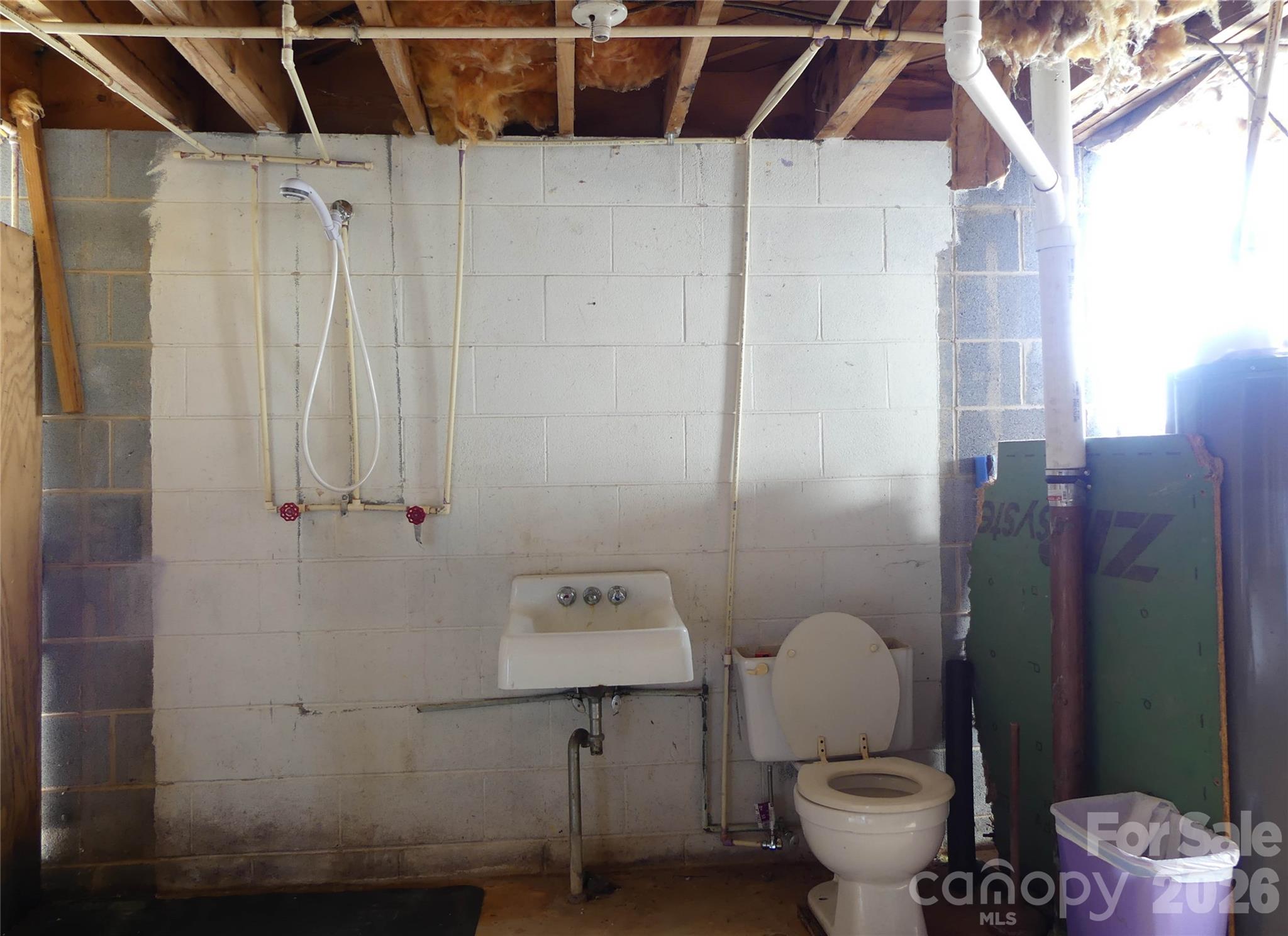 4636 Oak Hill School Road Lenoir, NC 28645 - Photo 22 of 23 a bathroom with a toilet and shower
