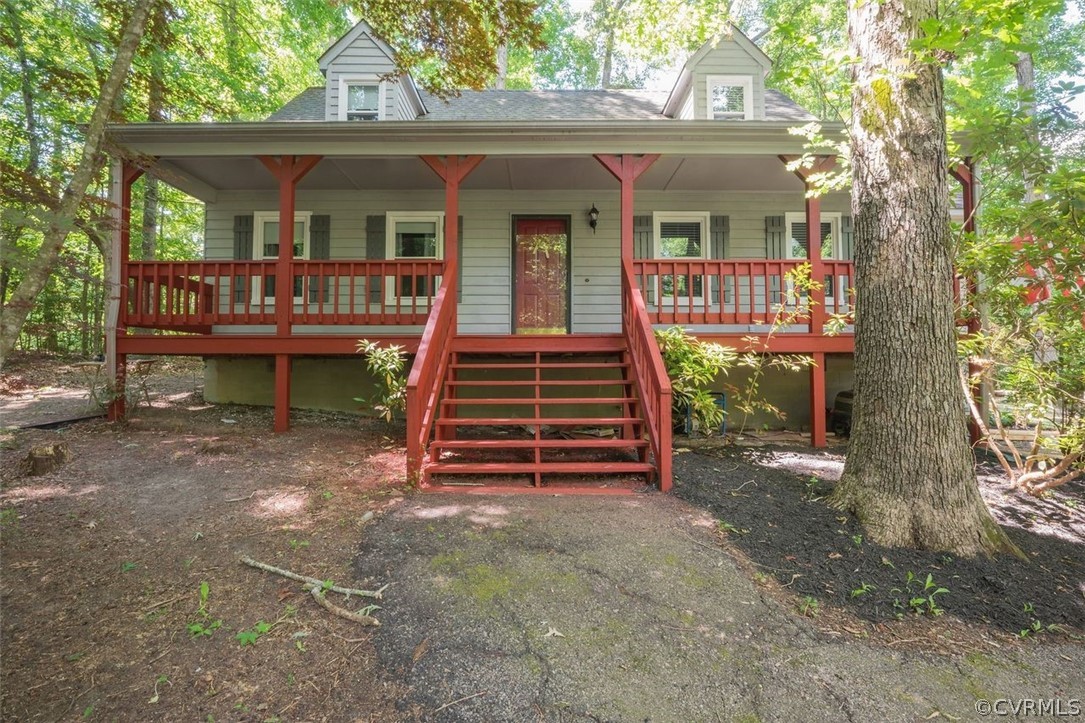 a front view of a house with deck