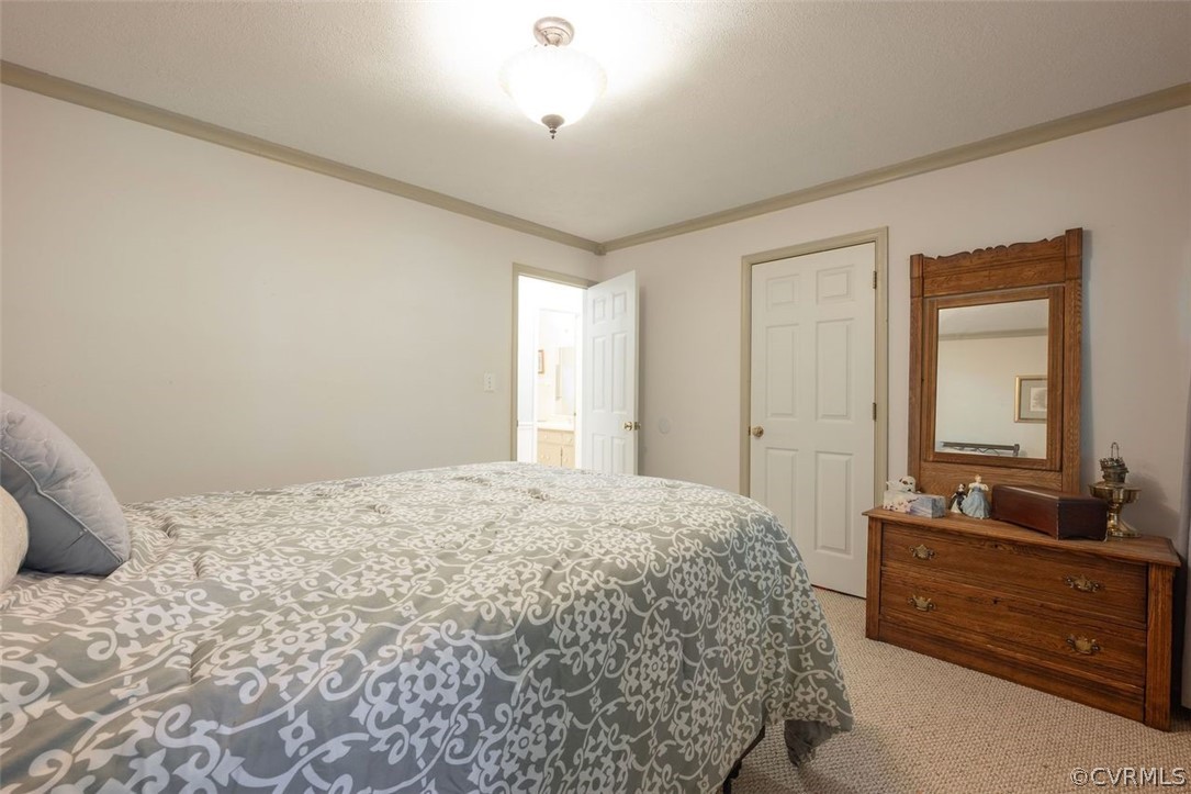 2734 Sutherland Road Sutherland, VA 23885 - Photo 15 of 28 a bedroom with a bed and a dresser