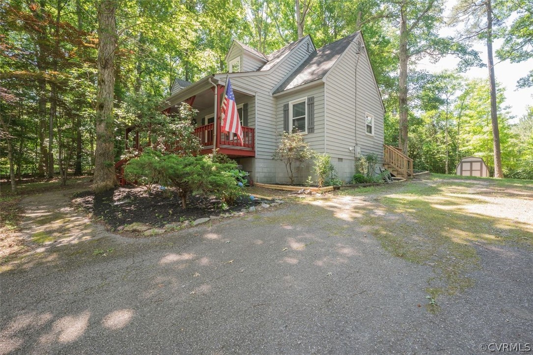 2734 Sutherland Road Sutherland, VA 23885 - Photo 2 of 28 a front view of a house with a yard and trees