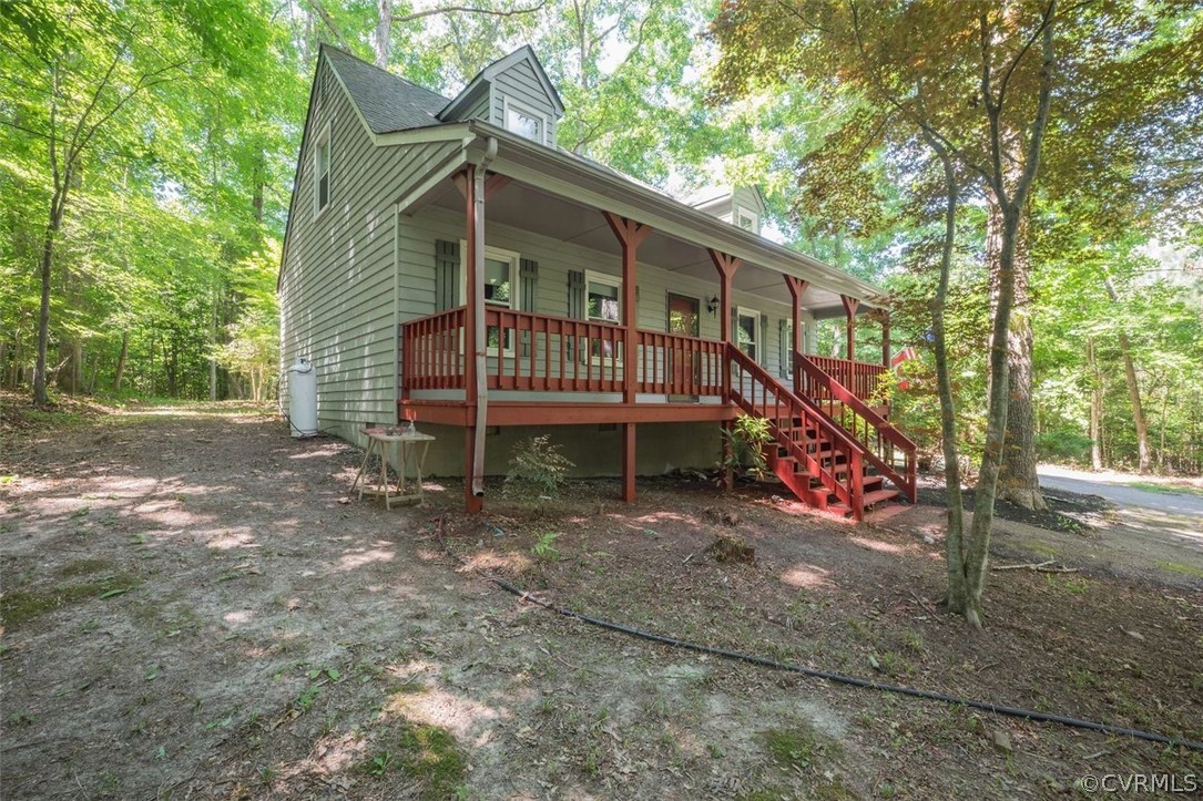 2734 Sutherland Road Sutherland, VA 23885 - Photo 22 of 28 a view of a wooden deck with a yard