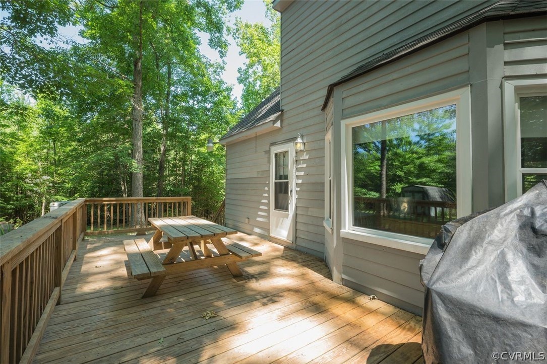2734 Sutherland Road Sutherland, VA 23885 - Photo 23 of 28 a balcony with furniture and wooden floor