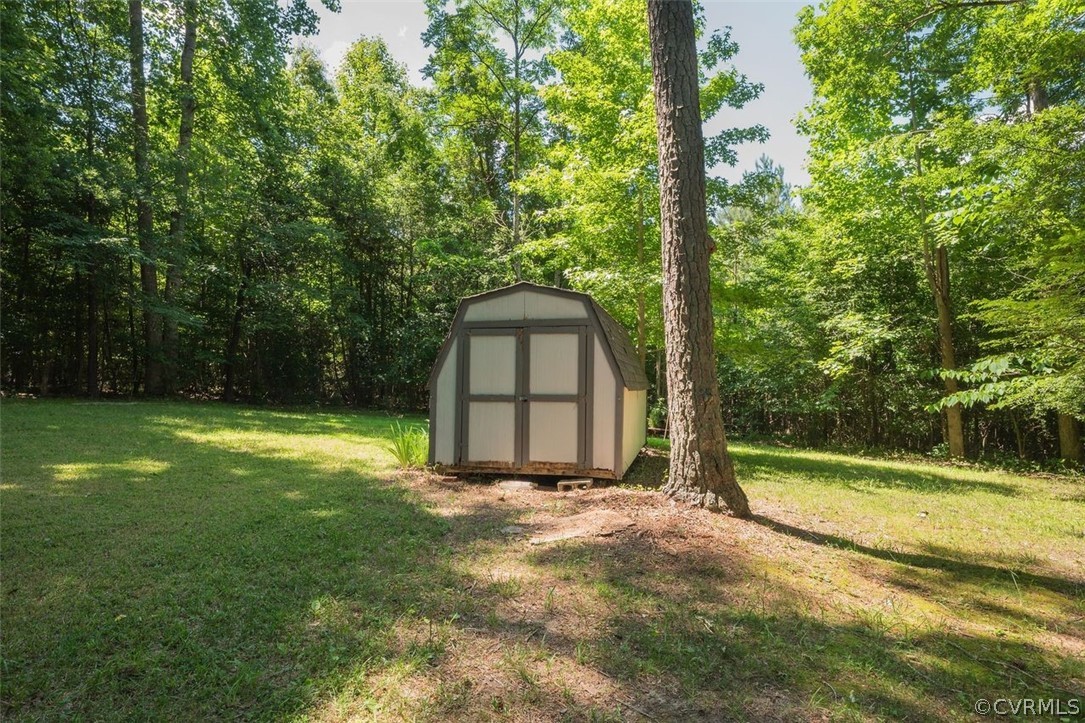 2734 Sutherland Road Sutherland, VA 23885 - Photo 28 of 28 a view of a backyard with large trees