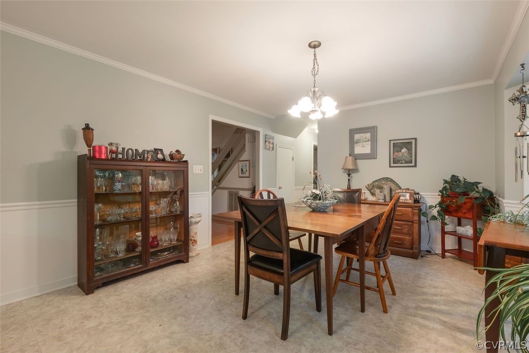 2734 Sutherland Road Sutherland, VA 23885 - Photo 9 of 28 a view of a dining room with furniture and chandelier
