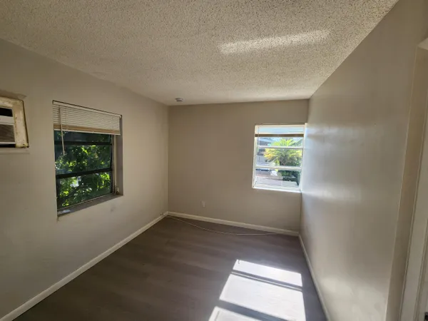 a view of closet area with empty racks