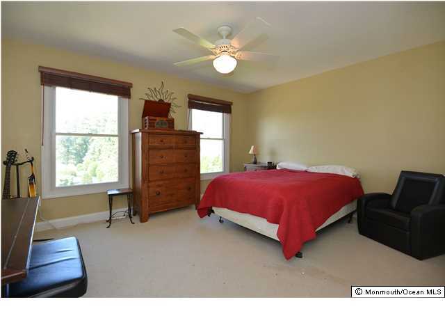 2103 Red Gate Road Allenwood, NJ 08720 - Photo 20 of 25 a living room with a bed furniture and a window