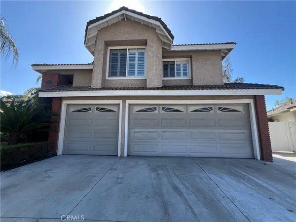 a front view of a house with a garage