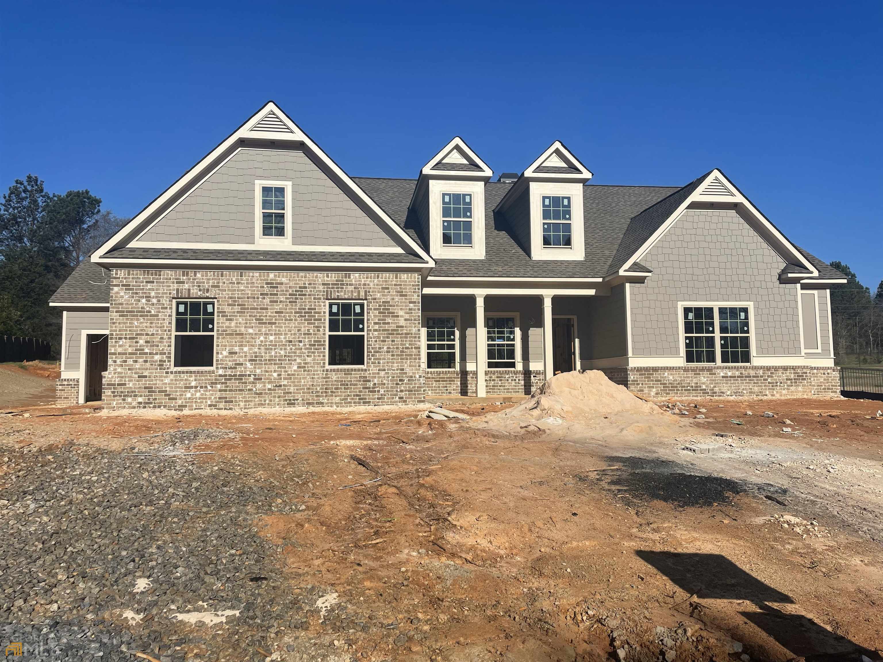 front view of a house with a yard