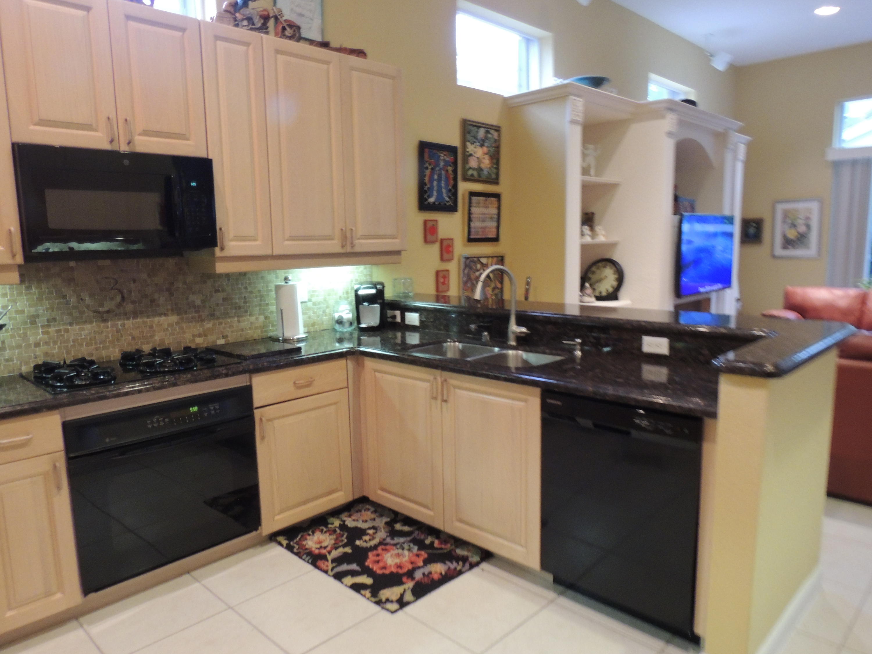 4281 Northwest 63rd Place Boca Raton, FL 33496 - Photo 9 of 44 LT OAK CABINETRY W/ NEW APP AND GRANITE